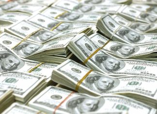 عملات: ارتفاع الدولار أمام الدينار الليبي بواقع 100 درهم