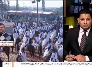 أكثر من ألفي فارس من عدة مدن ليبية يشاركون في مهرجان تاجوراء الشعبي الأول للفروسية، استمع للفارس علي الباجقني / أحد فرسان تاجوراء يضعك في تفاصيل المهرجان