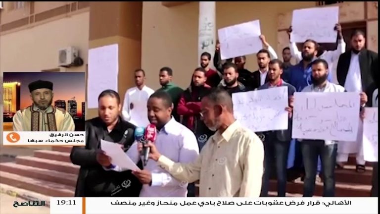 شاهد مداخلة حسن رقيق عضو مجلس حكماء سبها يتحدث عن واقعة إغلاق المجلس البلدي ومسببات ذالك