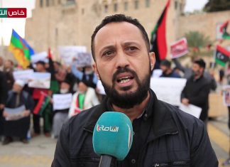 أحد المتظاهرين احتجاجا على الحكم الجائر الصادر بقضية مذبحة أبوسليم – ميدان الشهداء ـ طرابلس